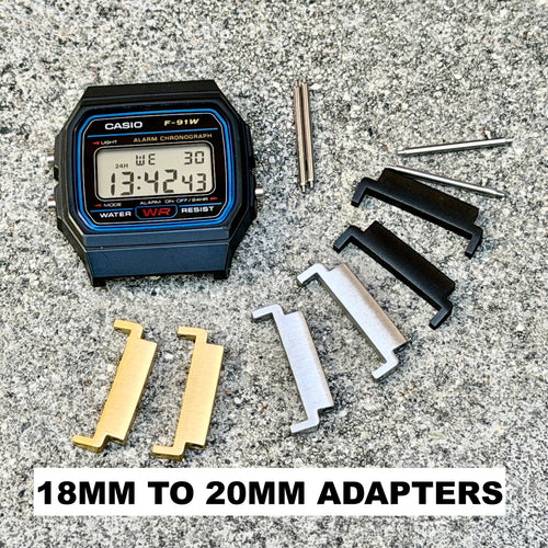 A Casio P-91W digital chronograph watch shown with several metal and plastic adapter pieces on a gray stone surface. The text overlay at the bottom reads '18mm to20mm adapters'.