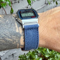 Casio A158W with navy canvas strap and brushed silver adapters