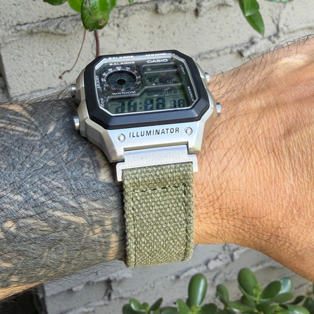 Casio AE-1200WHD Royale with olive canvas strap and brushed silver adapters